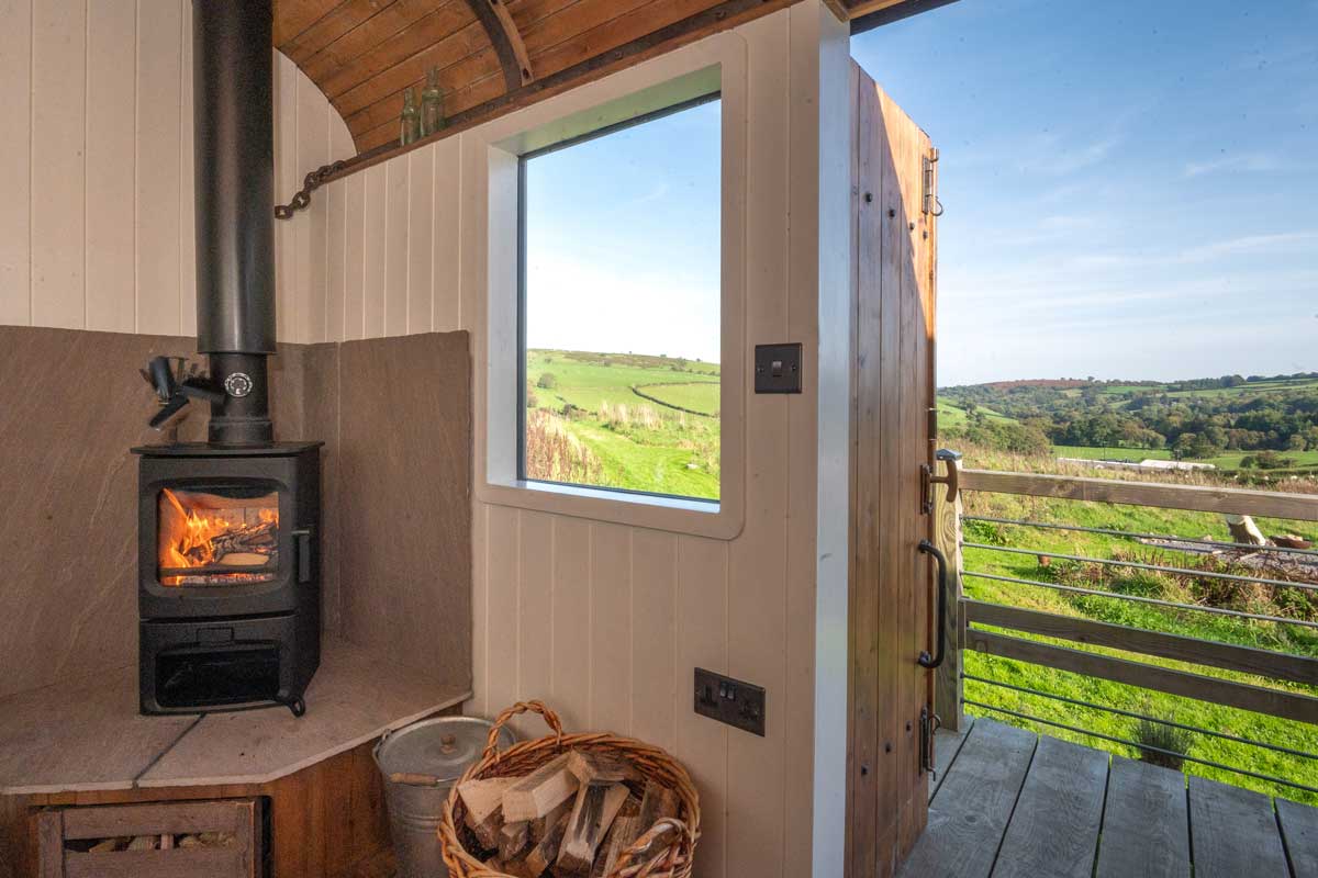 A log burner and amazing views! Unique accomodation in a train wagon. Stay in secluded luxury.